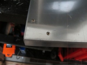Pot rivets holding tubing on to sheet