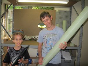 Jeremy and myself holding parts of the rocket.