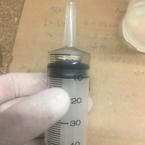 Measuring out 5 ml of 206 hardener